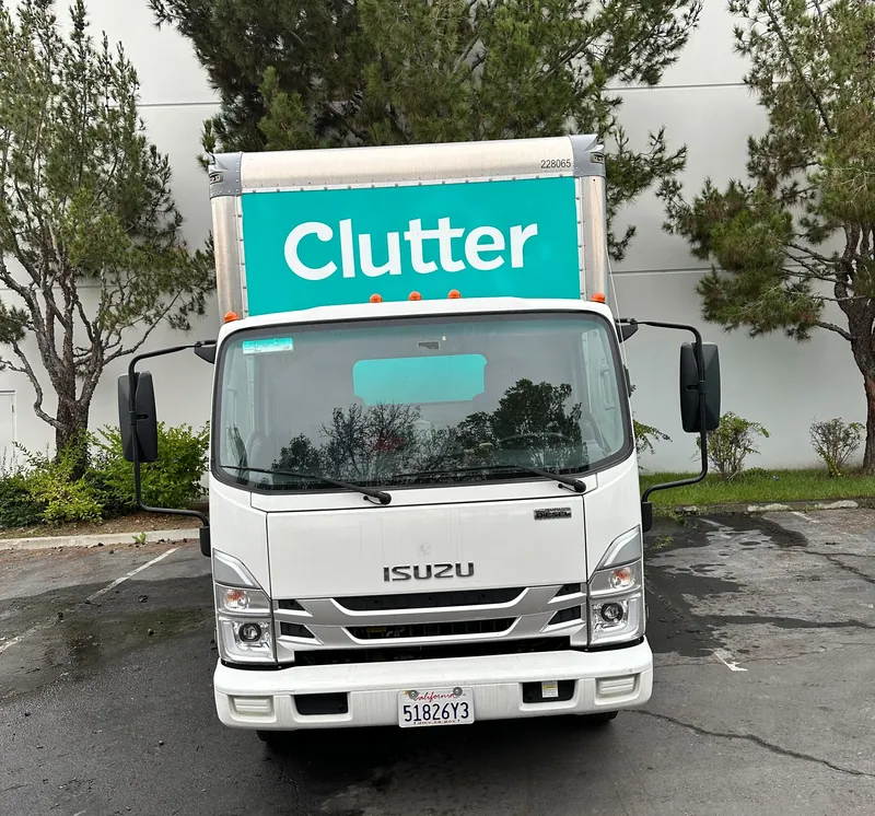 Clutter moving truck in a parking lot, before